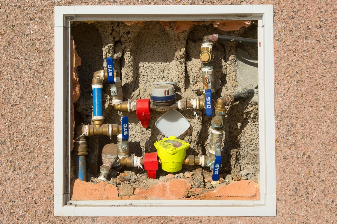 Water meter embedded in concrete wall
